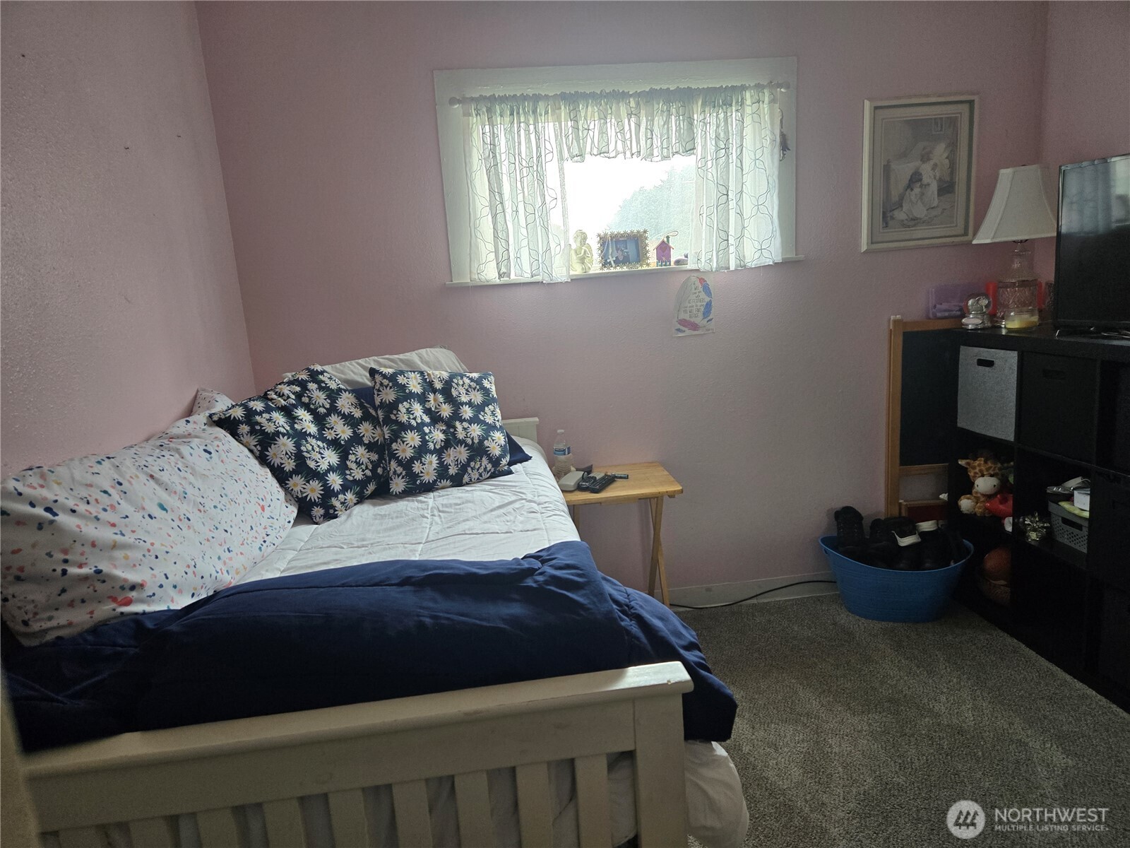 7610 Union Mills Road Southeast Lacey, WA 98503 - Photo 16 of 25 a bedroom with a bed and a window