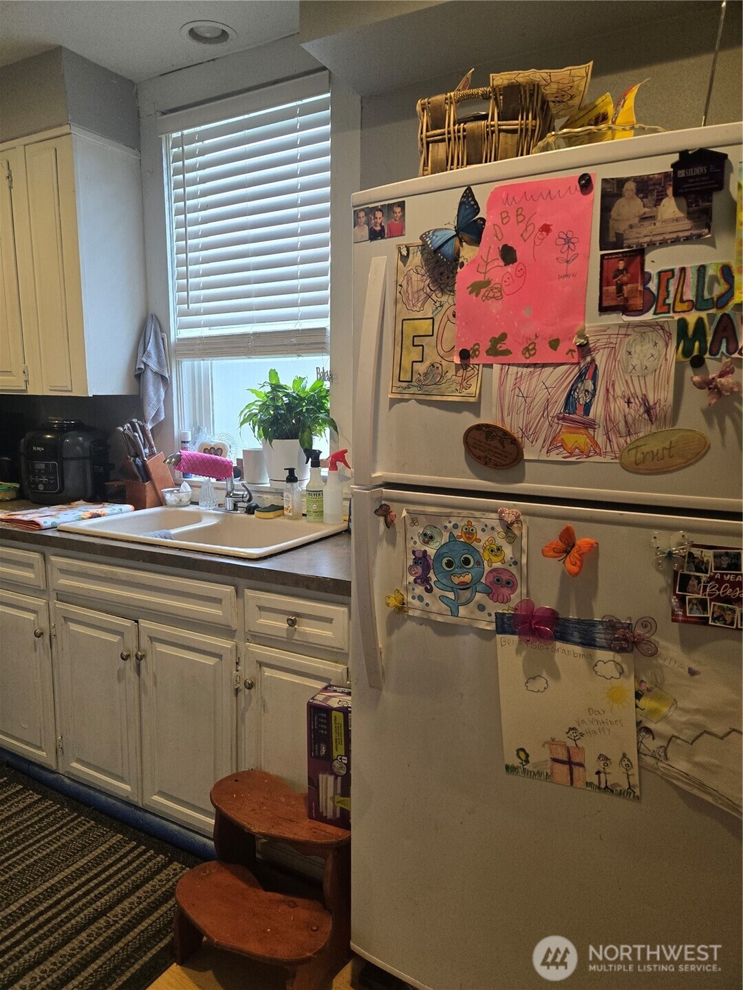 7610 Union Mills Road Southeast Lacey, WA 98503 - Photo 20 of 25 a kitchen with a refrigerator and cabinets