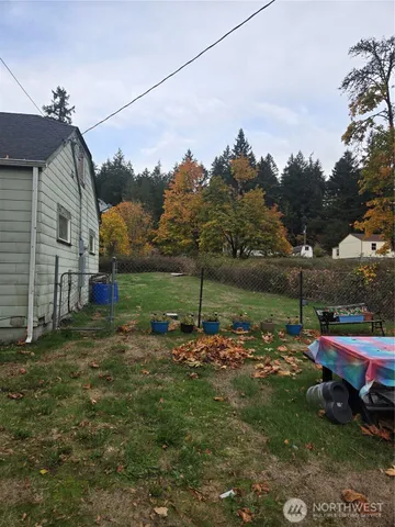 a backyard of a house with lots of green space