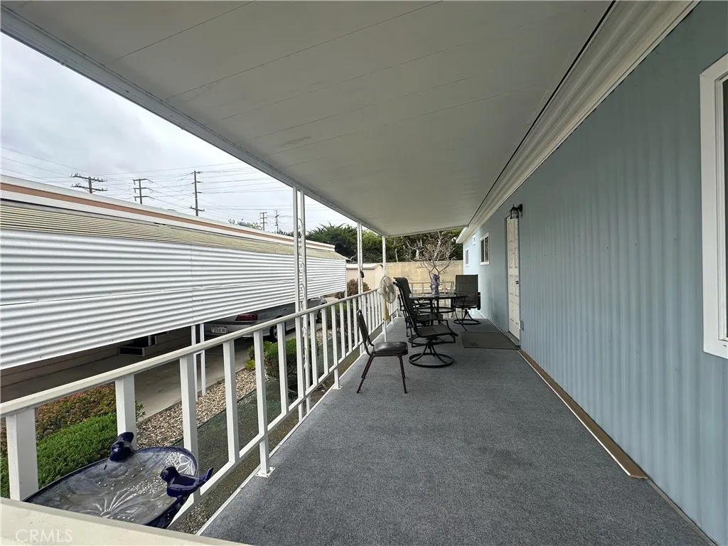 525 North Gilbert Street, Unit 151 Anaheim, CA 92801 - Photo 6 of 18 a view of a porch with furniture and garden