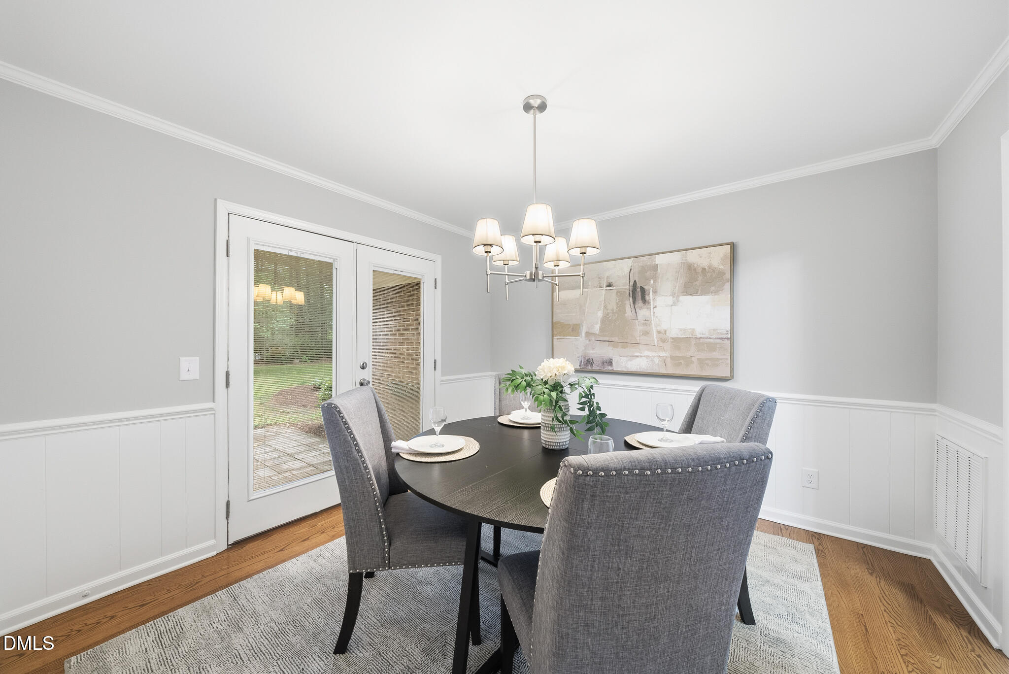 3404 Timberwood Court Raleigh, NC 27606 - Photo 13 of 45 a dining room with furniture a chandelier and wooden floor
