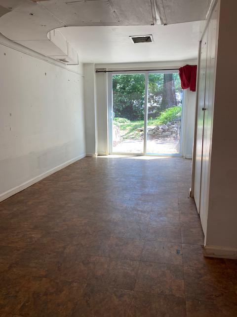 5707 Harwick Road Bethesda, MD 20816 - Photo 15 of 32 LL room with sliding glass door to backyard