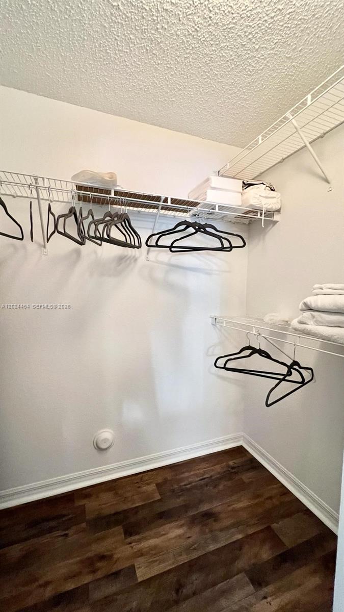 2727 Anzio Court, Unit 106 Palm Beach Gardens, FL 33410 - Photo 17 of 43 a view of a room with racks on the wall