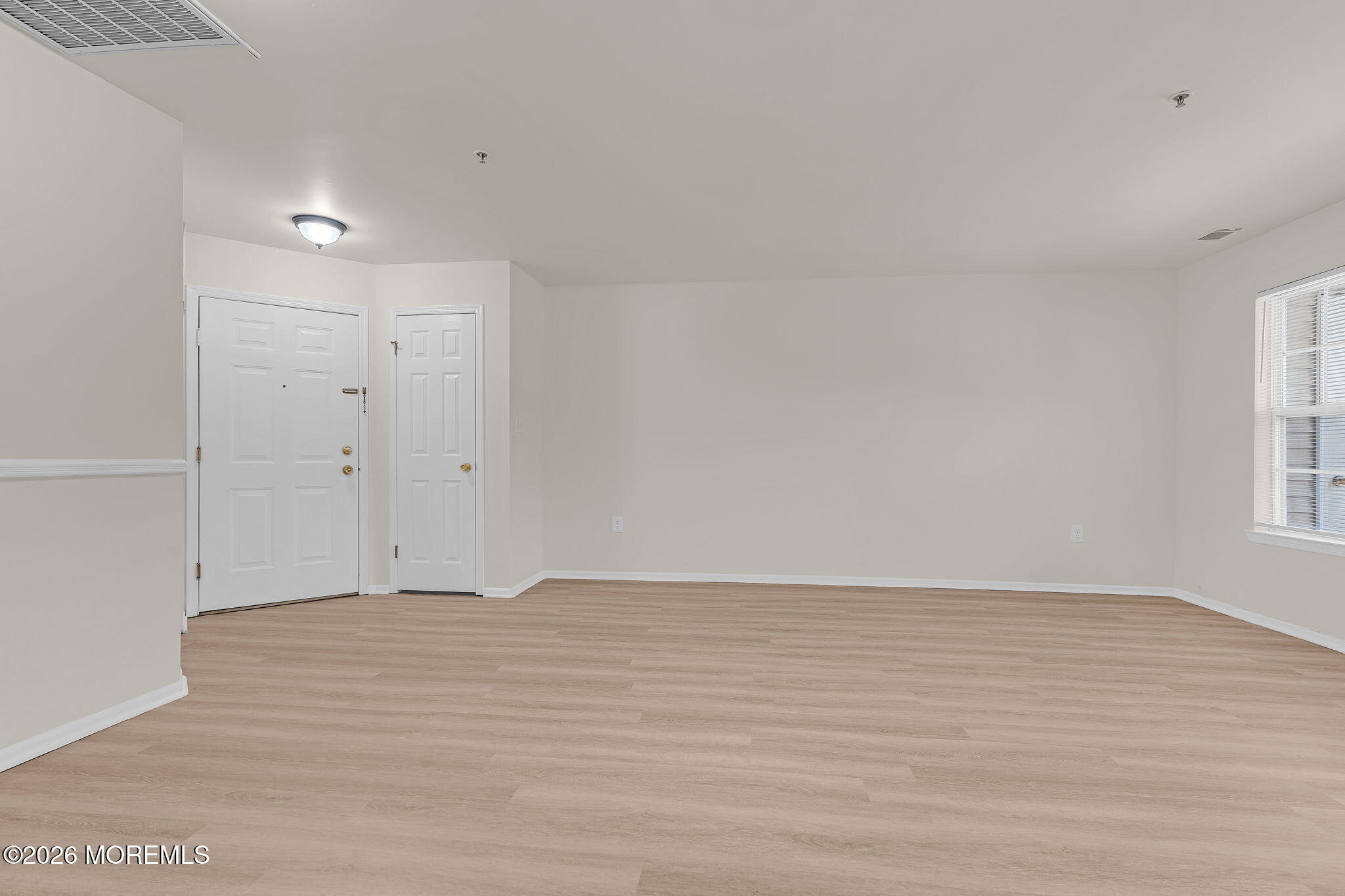 12 High Pointe Way Matawan, NJ 07747 - Photo 12 of 31 a view of an empty room with wooden floor