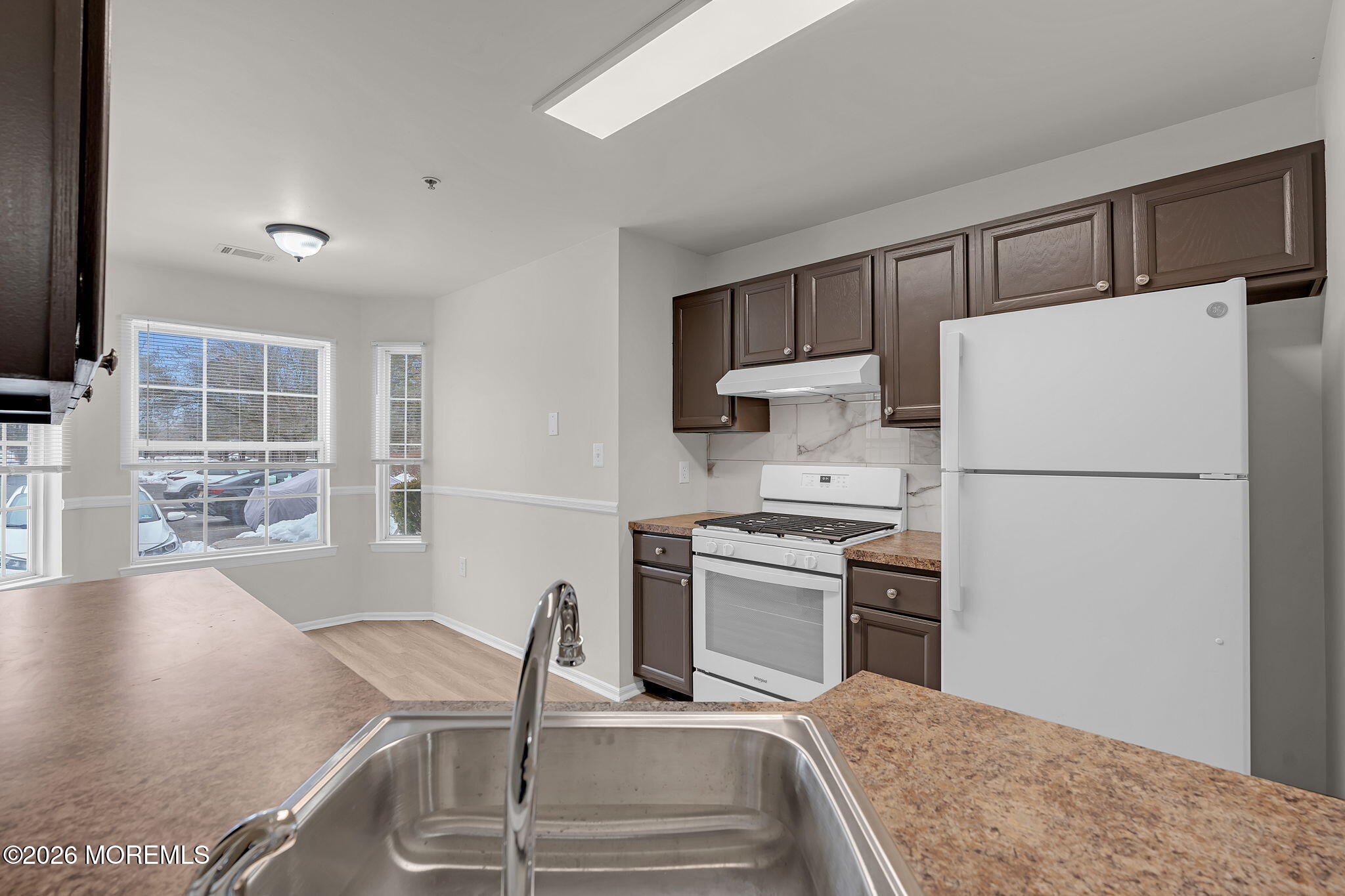 12 High Pointe Way Matawan, NJ 07747 - Photo 13 of 31 a kitchen with granite countertop a refrigerator stove top oven and sink