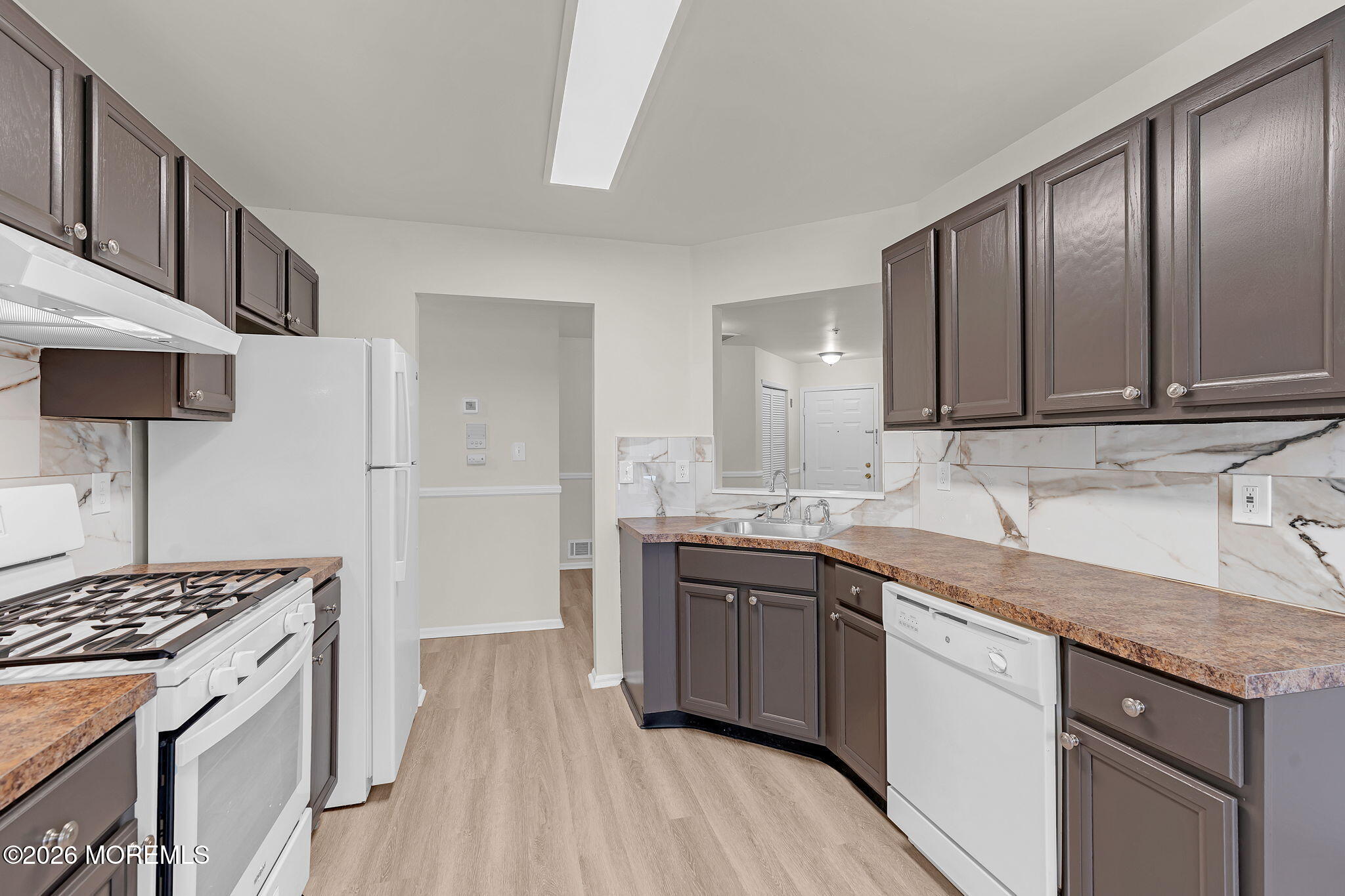 12 High Pointe Way Matawan, NJ 07747 - Photo 16 of 31 a kitchen with stainless steel appliances granite countertop a stove a sink dishwasher and a refrigerator