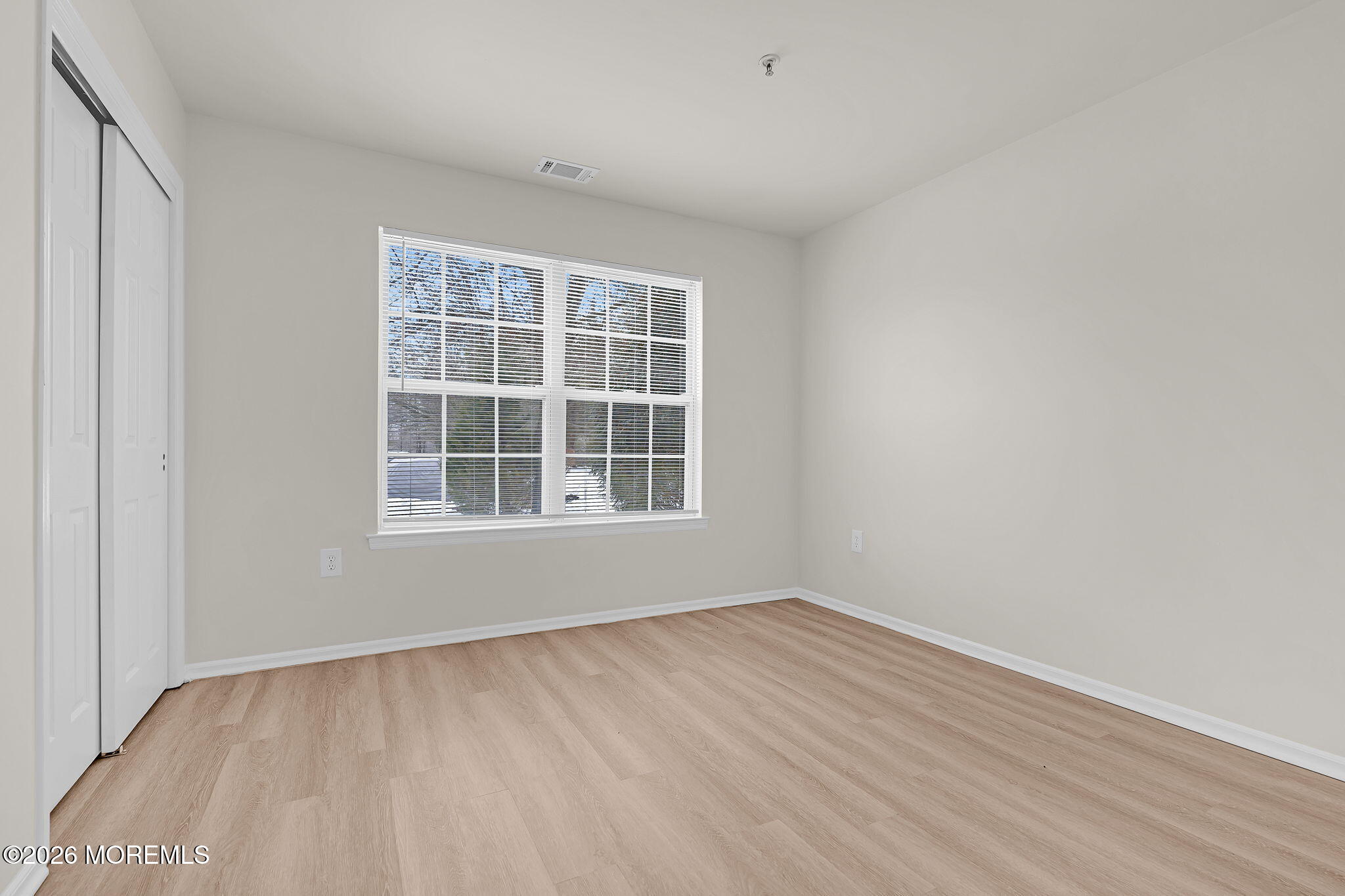 12 High Pointe Way Matawan, NJ 07747 - Photo 21 of 31 an empty room with wooden floor and windows