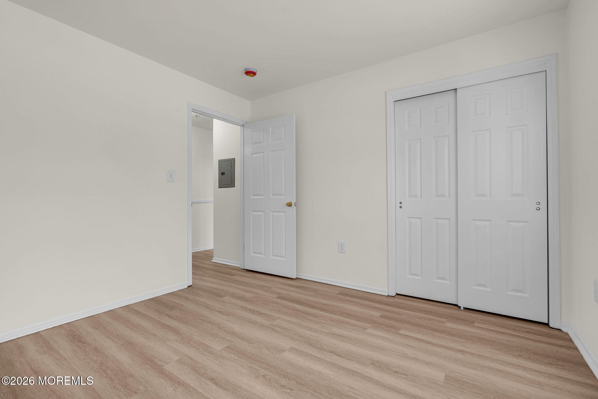 12 High Pointe Way Matawan, NJ 07747 - Photo 22 of 31 a view of an empty room with wooden floor
