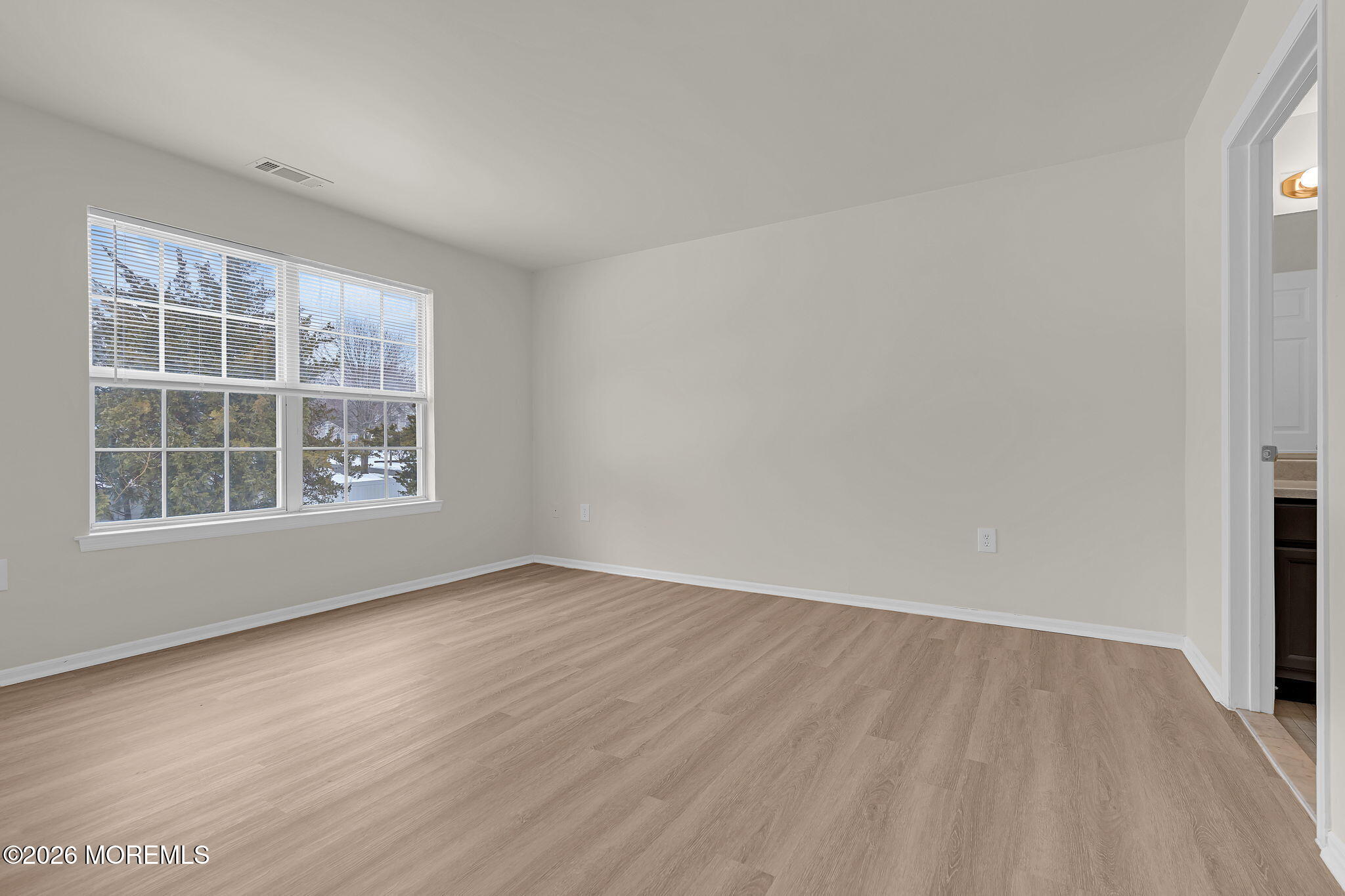 12 High Pointe Way Matawan, NJ 07747 - Photo 23 of 31 an empty room with wooden floor and windows
