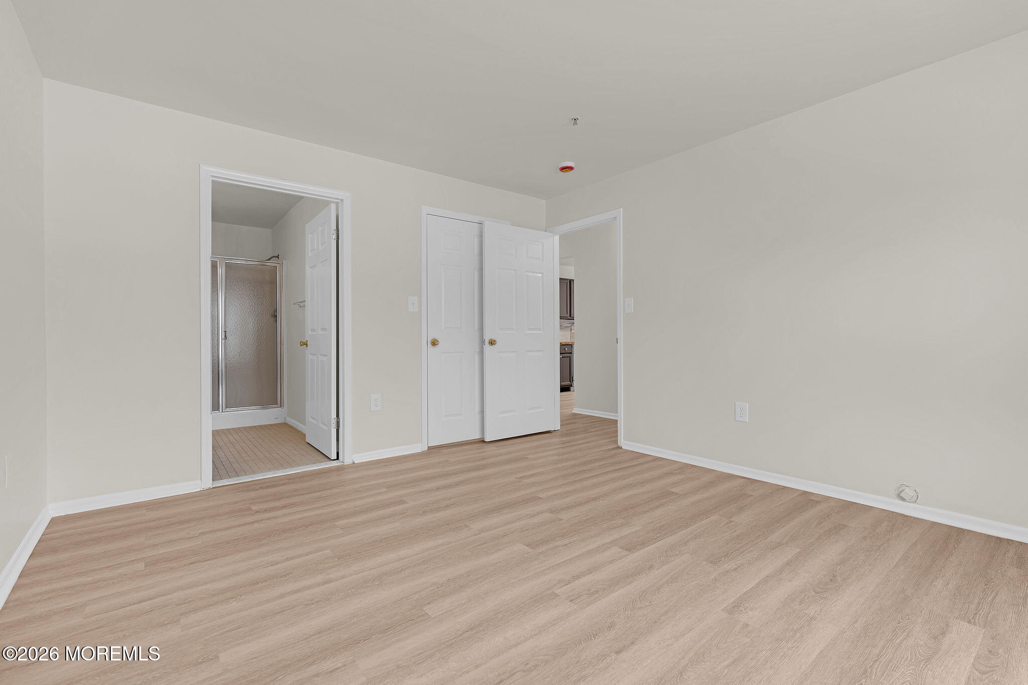 12 High Pointe Way Matawan, NJ 07747 - Photo 25 of 31 a view of an empty room with wooden floor