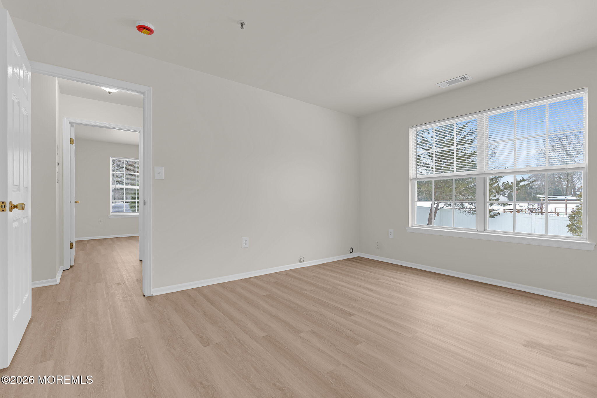 12 High Pointe Way Matawan, NJ 07747 - Photo 26 of 31 a view of an empty room with wooden floor and a window