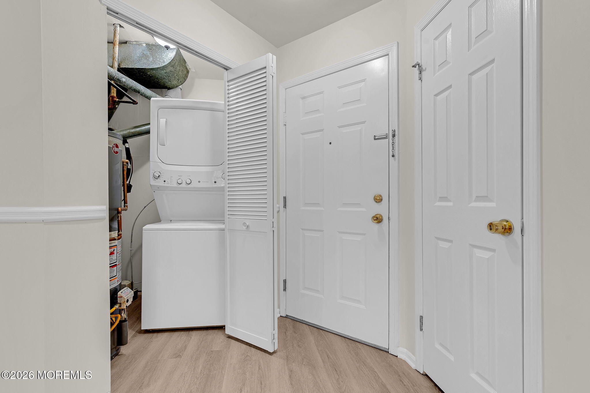 12 High Pointe Way Matawan, NJ 07747 - Photo 6 of 31 a view of storage and utility room with wooden floor