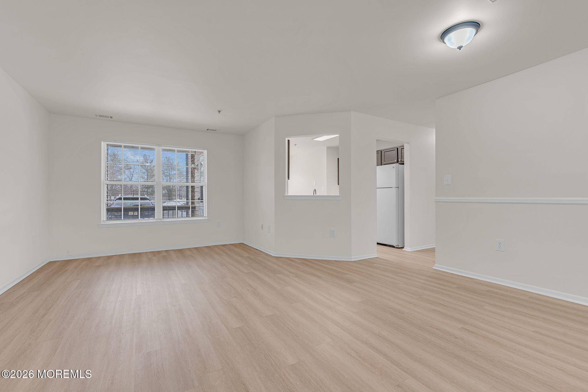 12 High Pointe Way Matawan, NJ 07747 - Photo 8 of 31 an empty room with wooden floor and windows