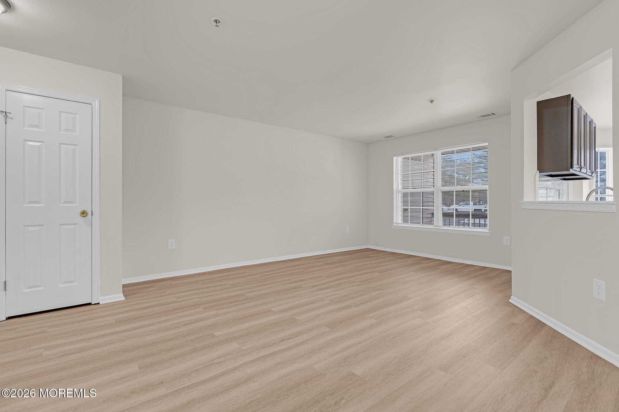 12 High Pointe Way Matawan, NJ 07747 - Photo 9 of 31 wooden floor in an empty room with a window