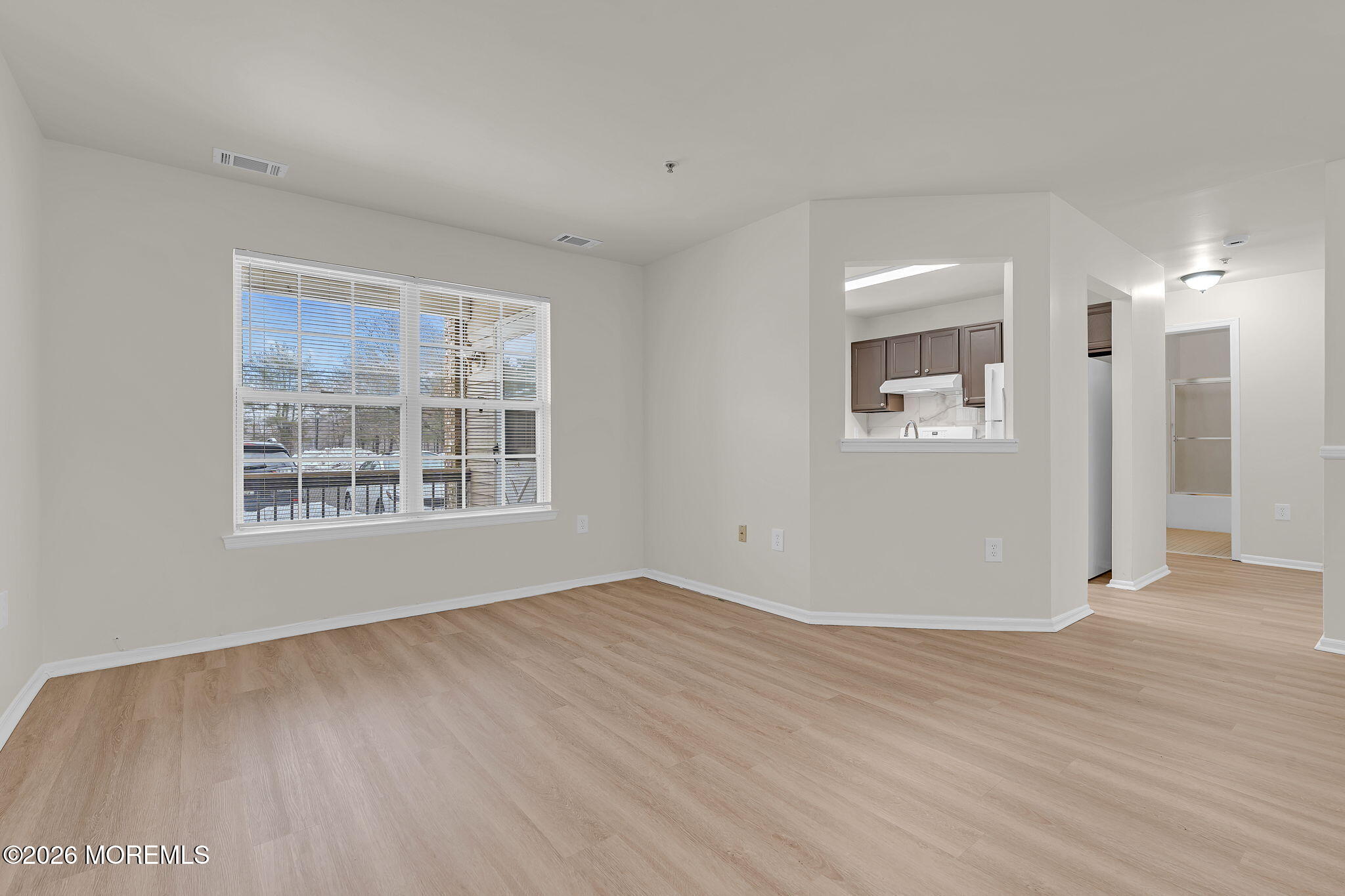 12 High Pointe Way Matawan, NJ 07747 - Photo 10 of 31 a view of an empty room with wooden floor and a window