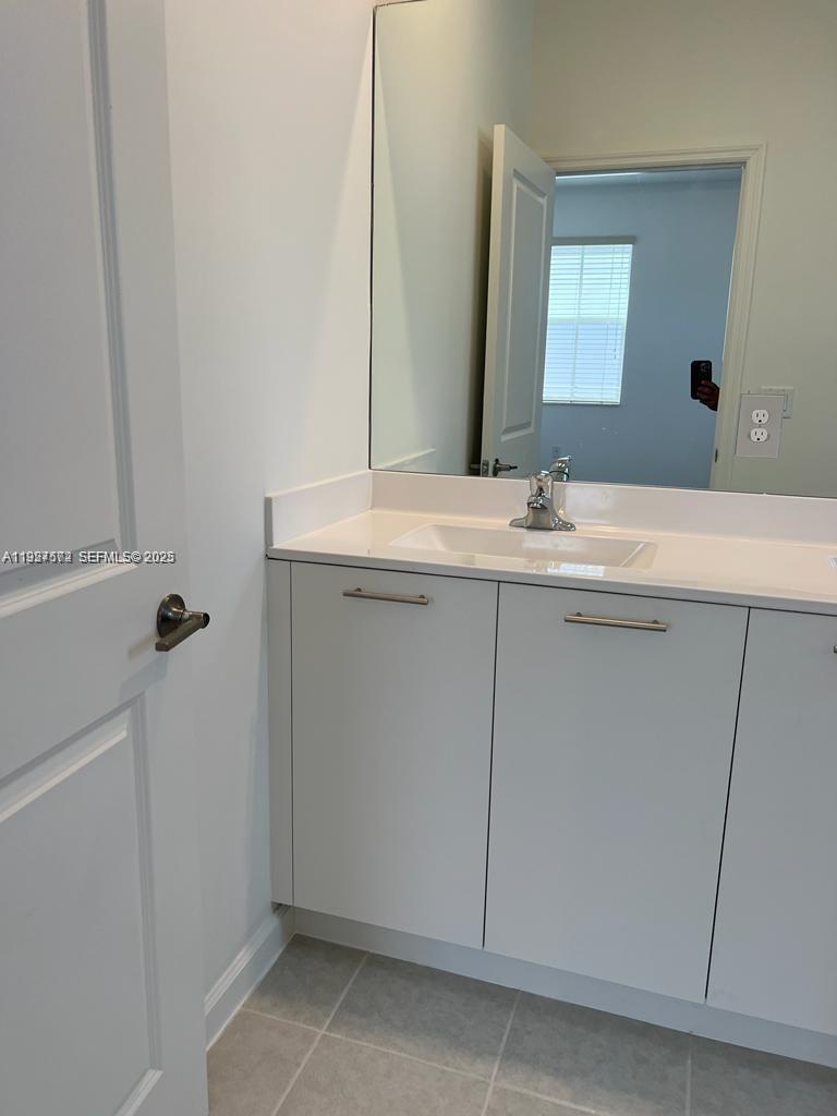 2281 Northwest 131st Circle Miami, FL 33167 - Photo 21 of 48 a bathroom with a sink and a mirror