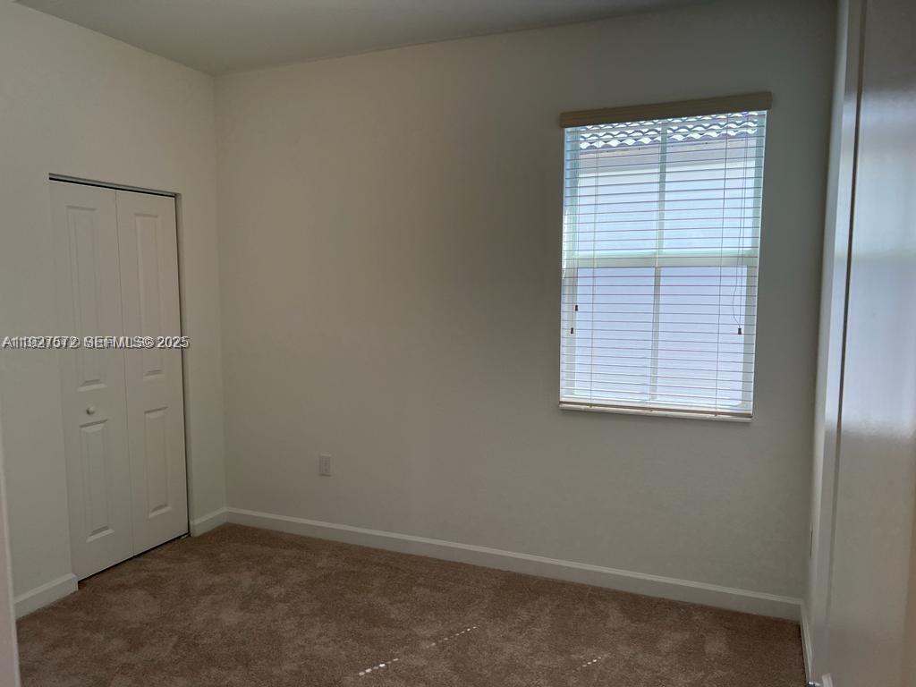 2281 Northwest 131st Circle Miami, FL 33167 - Photo 24 of 48 an empty room with a window