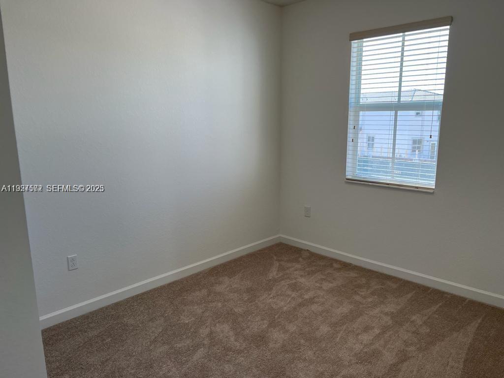2281 Northwest 131st Circle Miami, FL 33167 - Photo 27 of 48 an empty room with a window