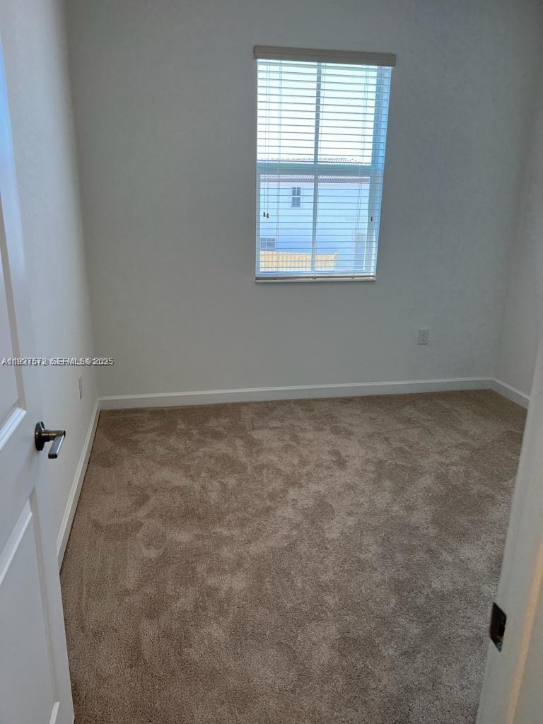 2281 Northwest 131st Circle Miami, FL 33167 - Photo 30 of 48 an empty room with a window