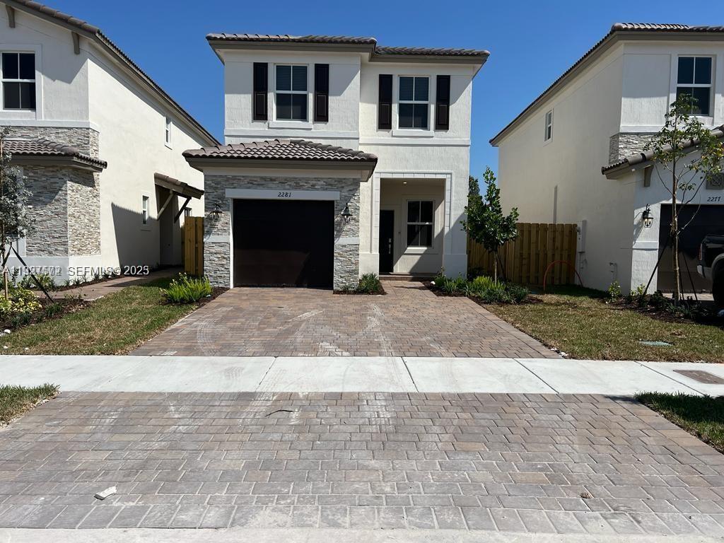 2281 Northwest 131st Circle Miami, FL 33167 - Photo 3 of 48 a front view of a house with yard