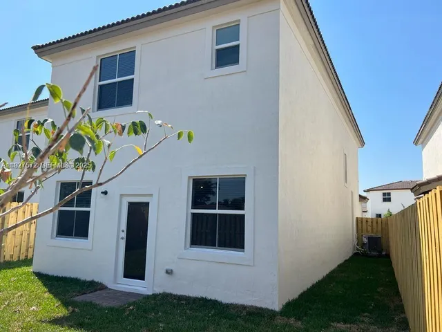 a view of front door and yard