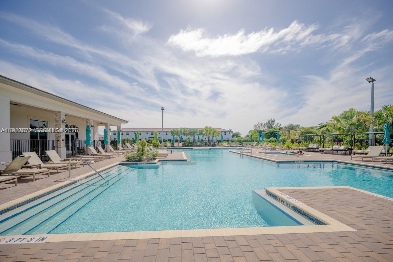 2281 Northwest 131st Circle Miami, FL 33167 - Photo 41 of 48 a view of swimming pool from a lake