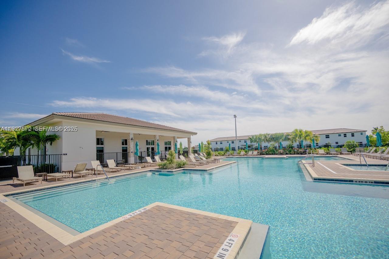 2281 Northwest 131st Circle Miami, FL 33167 - Photo 42 of 48 a view of a house with pool and lake view