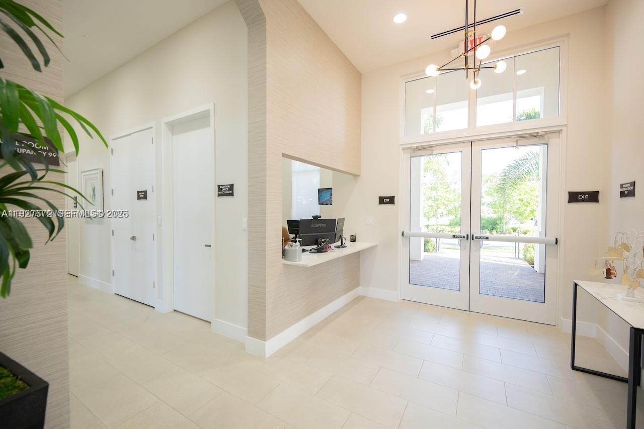 2281 Northwest 131st Circle Miami, FL 33167 - Photo 47 of 48 a large white kitchen with cabinets a sink and a window