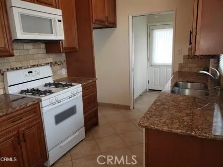 a kitchen with a stove and a microwave
