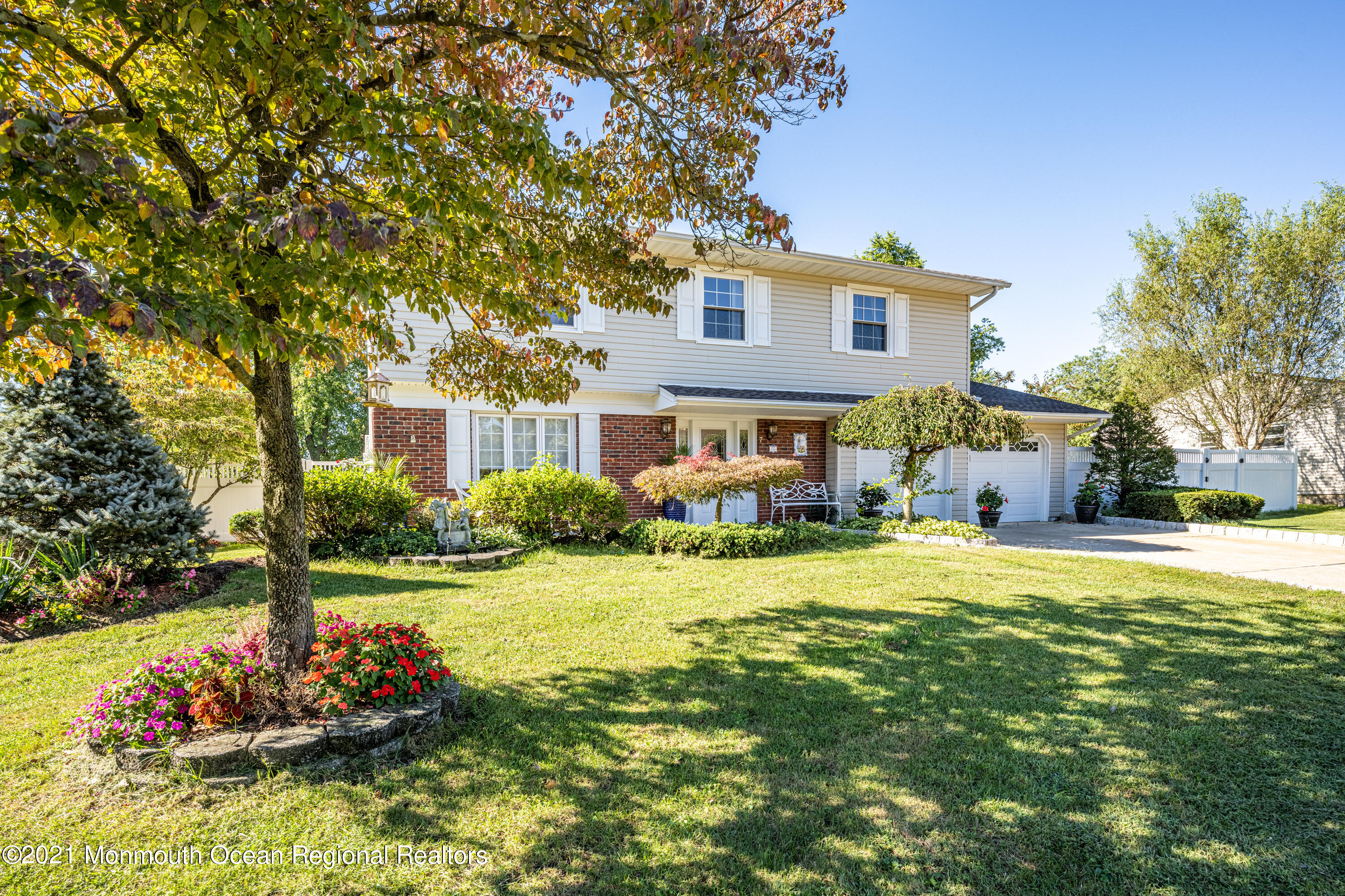 7 Westbrook Road Howell, NJ 07731 - Photo 2 of 32 a front view of a house with a yard and garage