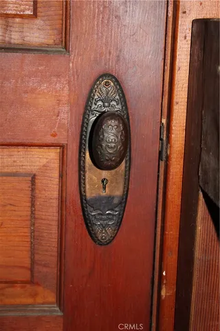 an empty room with a fireplace and window