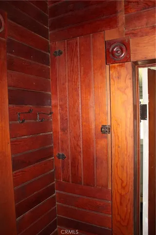 an empty room with a window and a ceiling fan