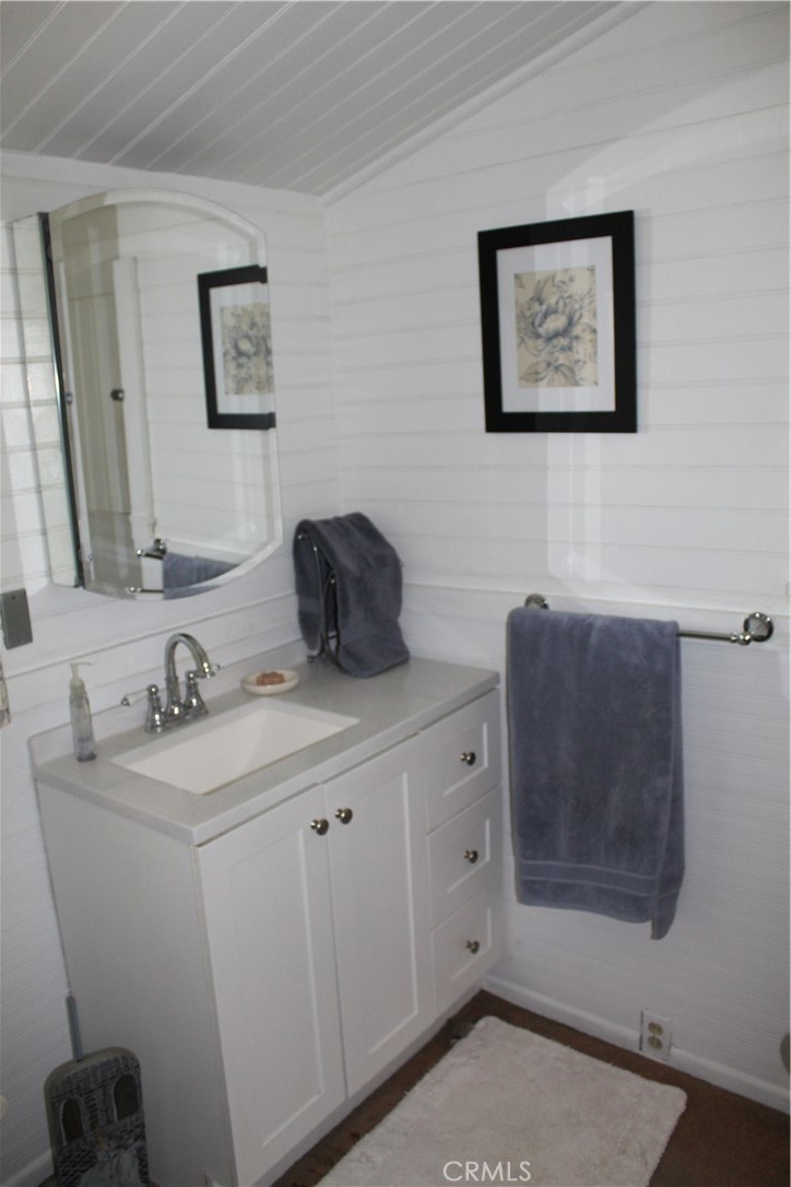 1414 Marin Street Corning, CA 96021 - Photo 35 of 71 a bathroom with a sink a toilet and mirror