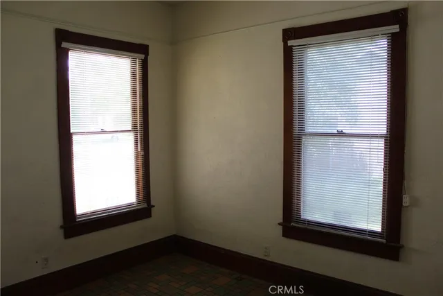 a view of storage and utility room with closet window