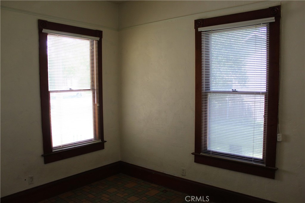 1414 Marin Street Corning, CA 96021 - Photo 41 of 71 a view of an empty room with wooden floor and a window