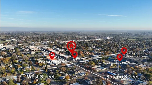 a view of empty room with wooden floor and front door