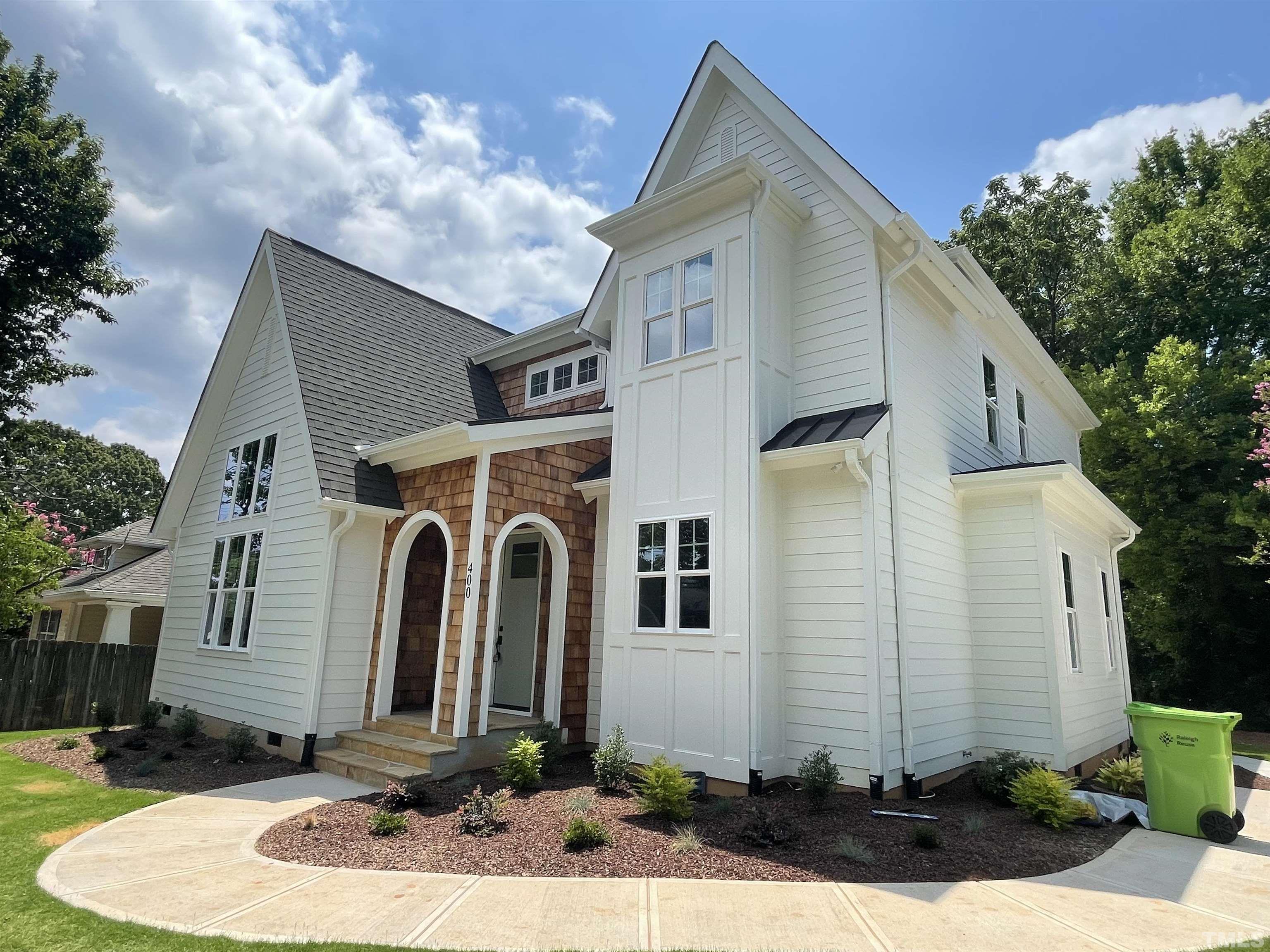 400 Pershing Road Raleigh, NC 27608 - Photo 1 of 33 a front view of a house with a yard
