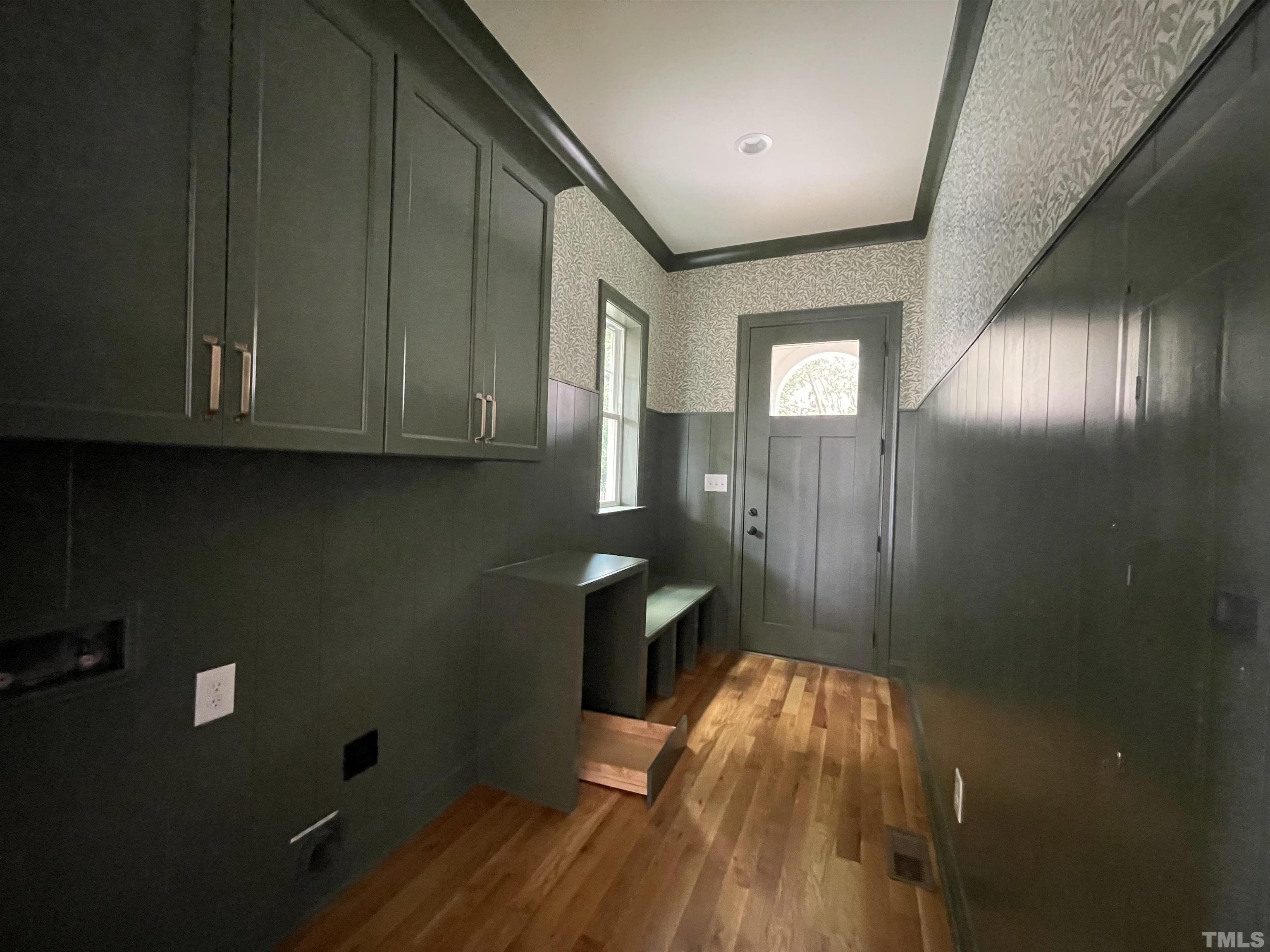 400 Pershing Road Raleigh, NC 27608 - Photo 13 of 33 a view of a livingroom with wooden floor and staircase