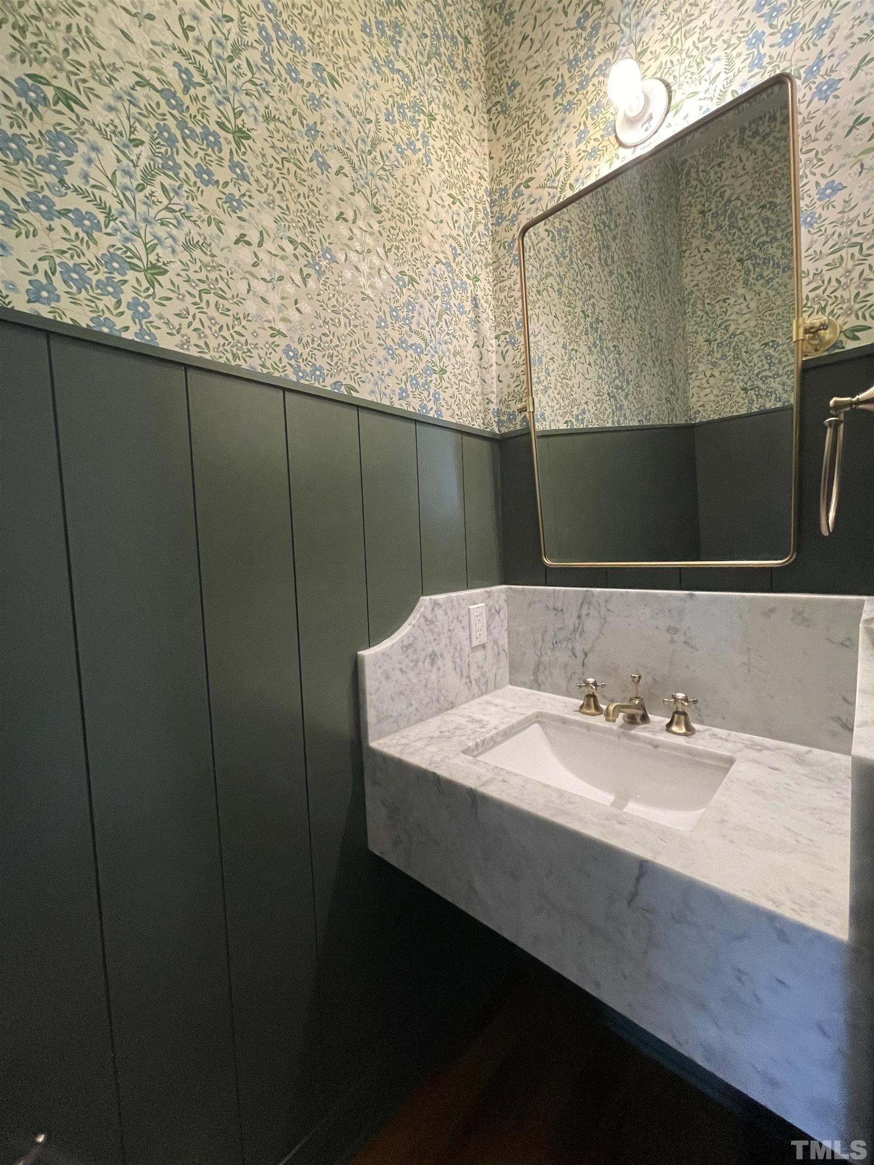 400 Pershing Road Raleigh, NC 27608 - Photo 16 of 33 a bathroom with a sink and a mirror