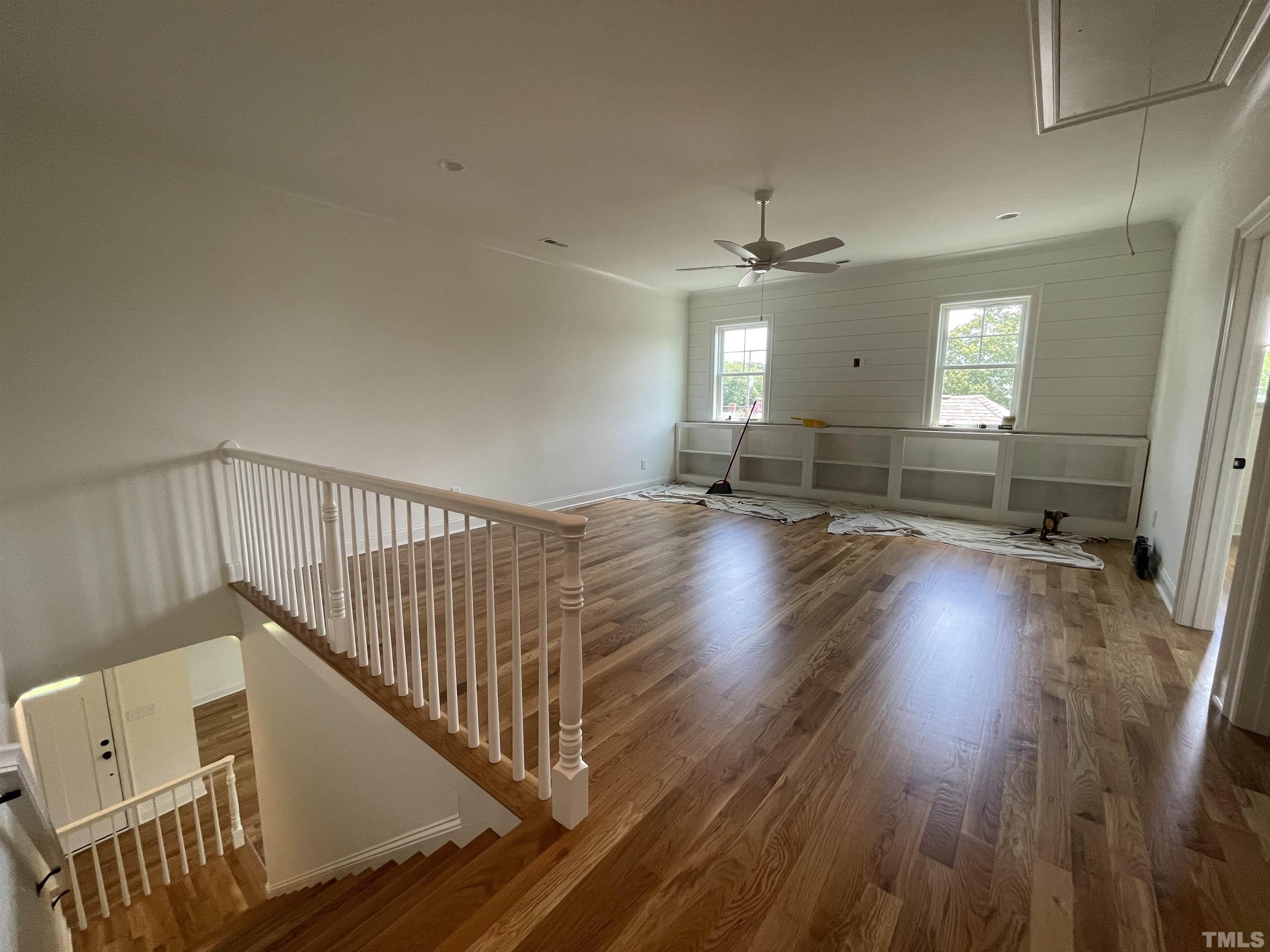 400 Pershing Road Raleigh, NC 27608 - Photo 22 of 33 a view of an empty room with wooden floor