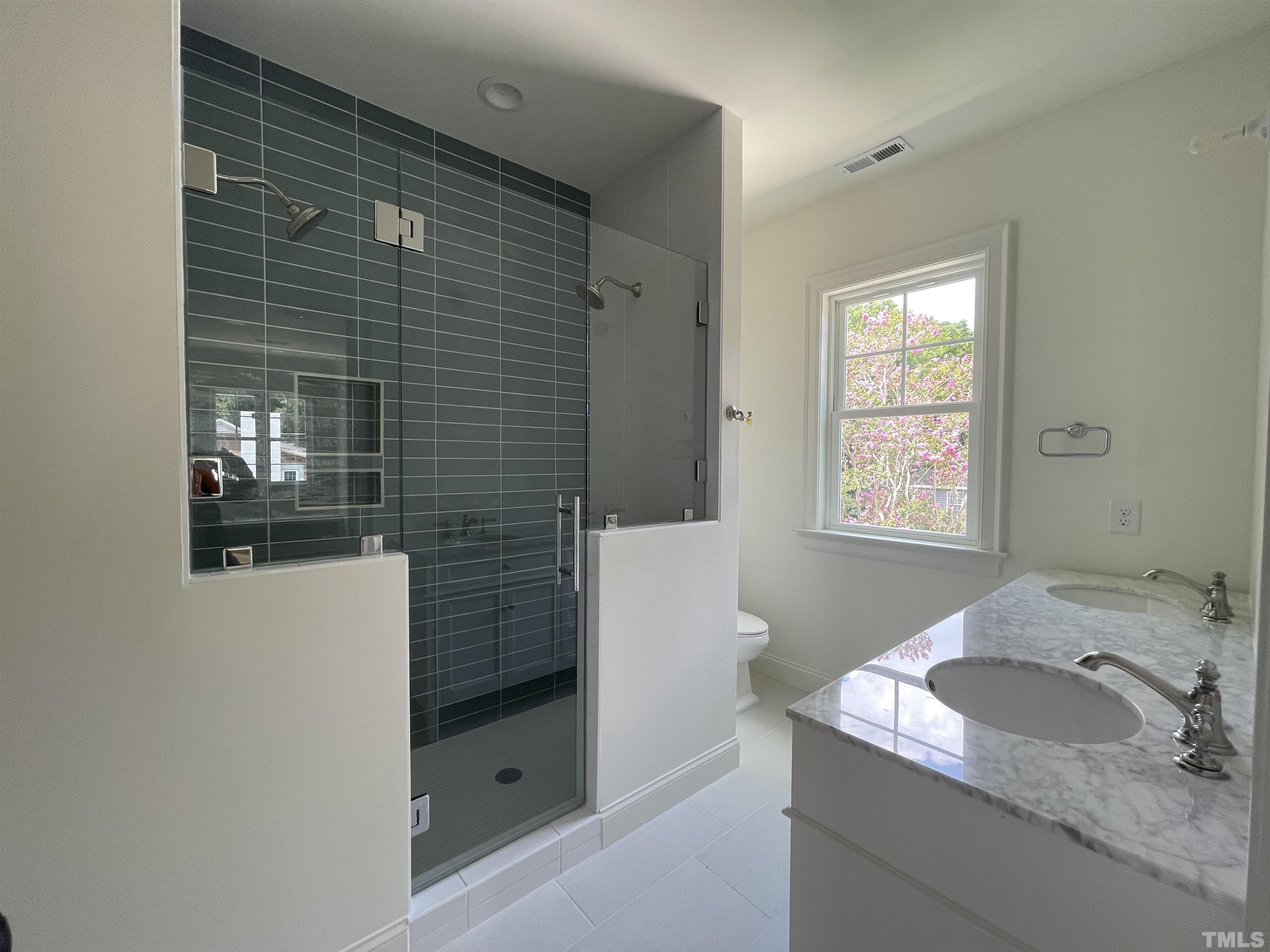 400 Pershing Road Raleigh, NC 27608 - Photo 27 of 33 a bathroom with a granite countertop sink and mirror