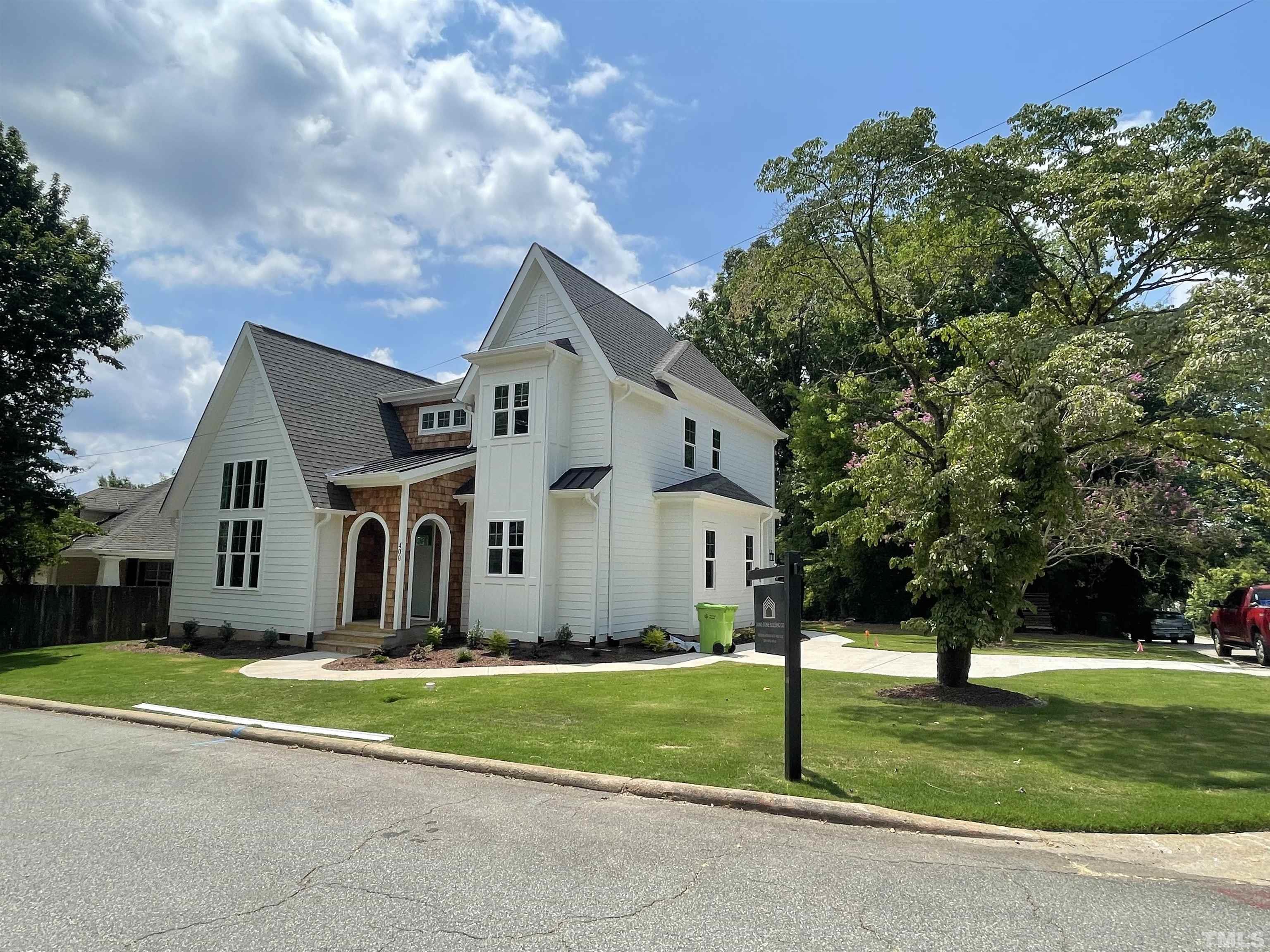 400 Pershing Road Raleigh, NC 27608 - Photo 4 of 33 a front view of a house with a yard