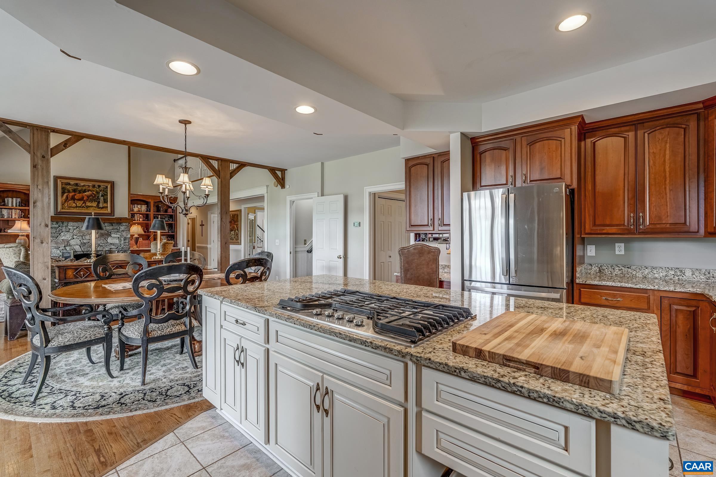 3240 Darby Road Keswick, VA 22947 - Photo 54 of 70 a kitchen with stainless steel appliances granite countertop a stove refrigerator and cabinets