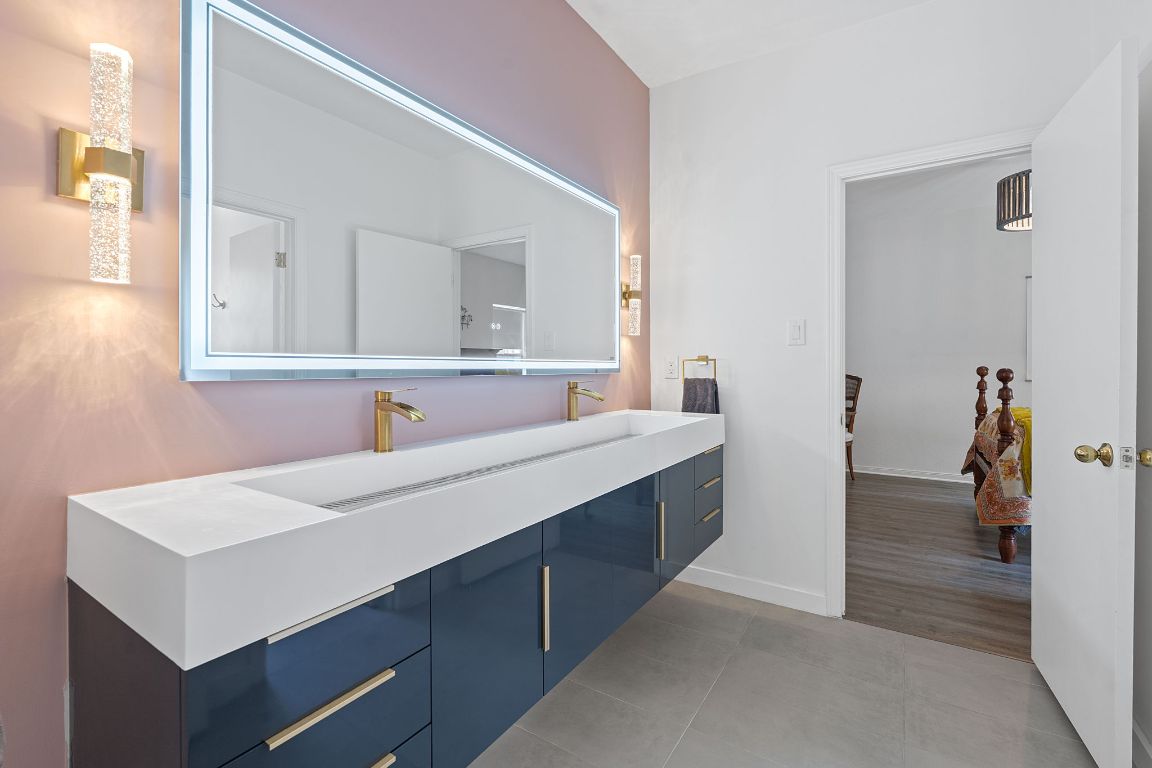 6302 Gato Path Austin, TX 78731 - Photo 27 of 37 Bathroom with double vanity and tile patterned floors