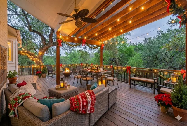 a roof deck with patio and outdoor seating