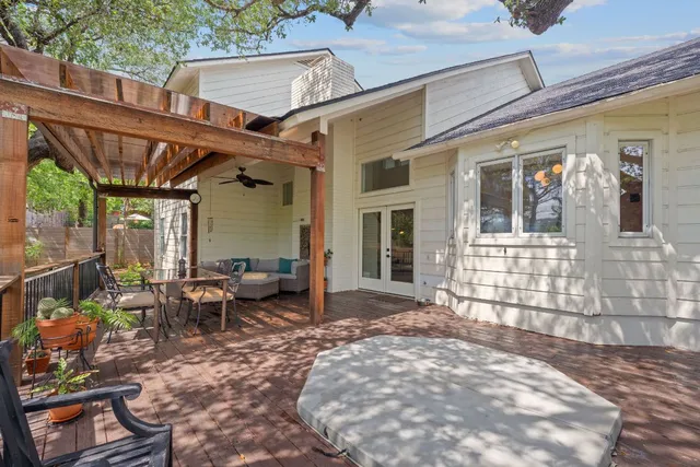 a backyard of a house with outdoor seating