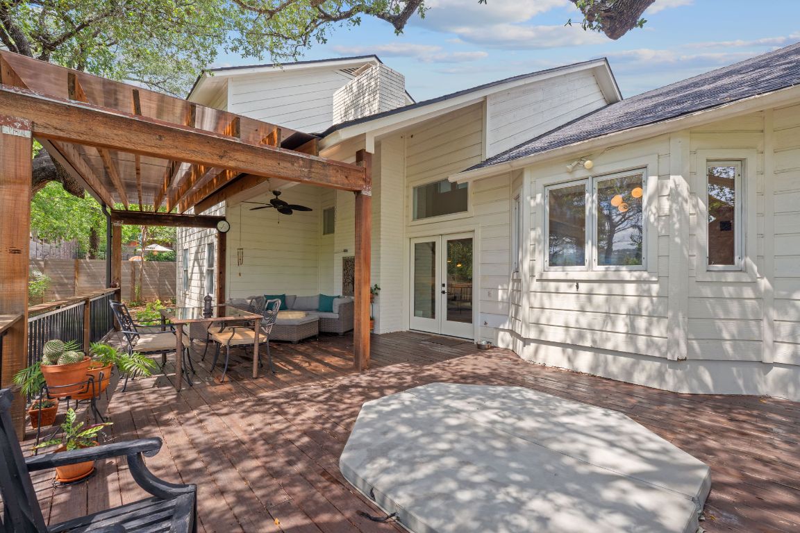 6302 Gato Path Austin, TX 78731 - Photo 33 of 37 View of patio with ceiling fan, a wooden deck, an outdoor hangout area, french doors, and outdoor dining space