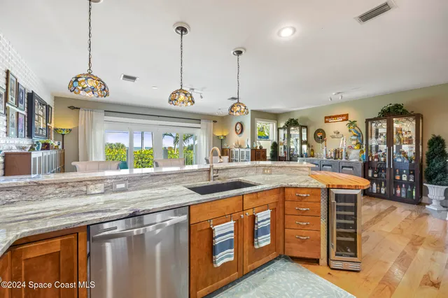 a view of a living room and kitchen