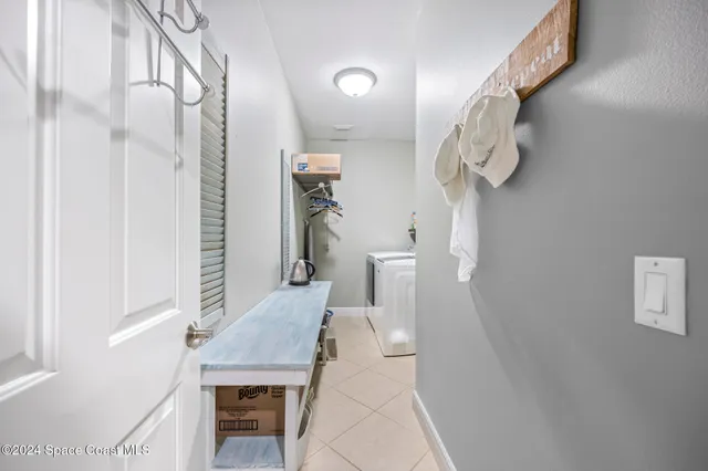 a bathroom with a granite countertop sink toilet and mirror