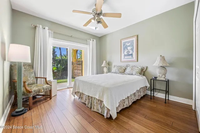 a bathroom with a granite countertop toilet a sink and a mirror